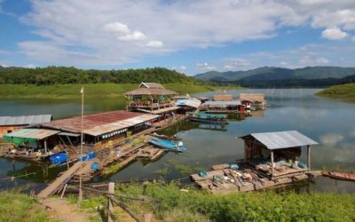 Crossing the Sirikit Dam by local ferry in Northern Thailand