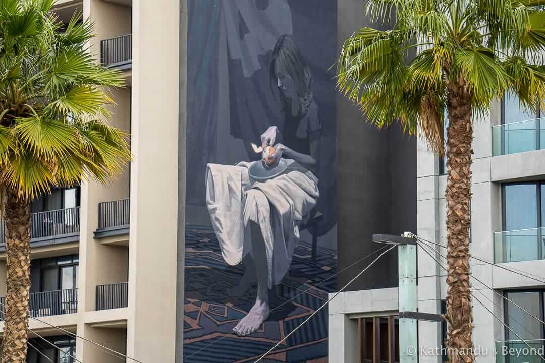 Girl with orange by Etam Cru, City Walk Street Art Dubai, United Arab Emirates